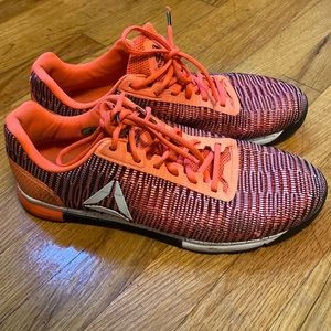 Orange Reebok sneakers